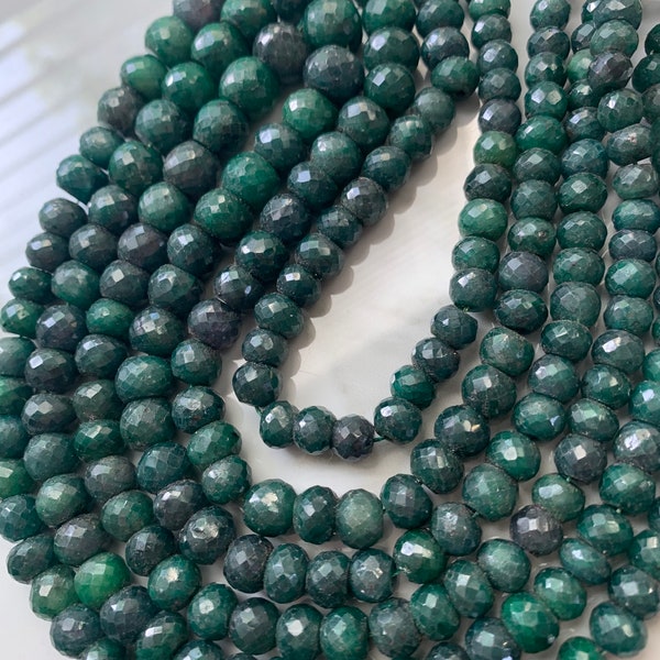 Faceted emerald roundels