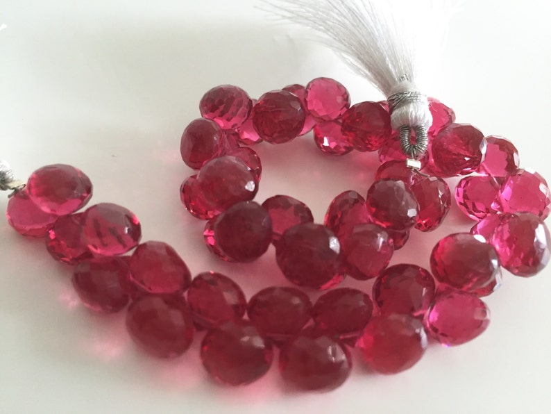 Pomegranate colored hydro quartz faceted onion