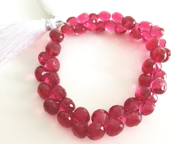 Pomegranate colored hydro quartz faceted onion
