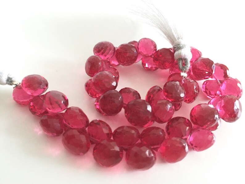 Pomegranate colored hydro quartz faceted onion