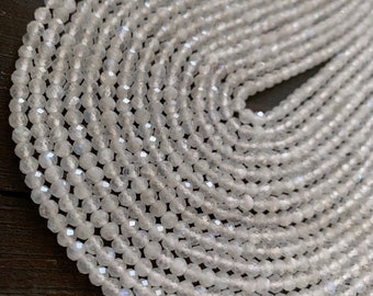 1/2 strand white topaz round beads