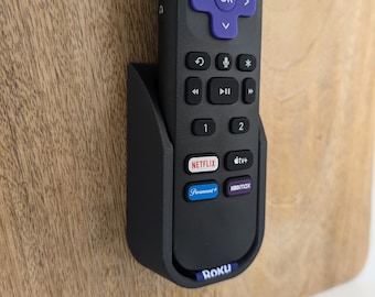 Wallmote dla Roku Voice Remote Pro - Original – Elegancki i bezpieczny uchwyt na pilota montowany na ścianie.