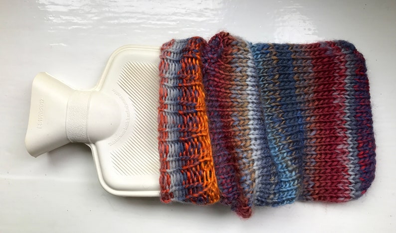 Mini hot water bottle and hand knitted lightly felted cozy, wool rich cover, mini 500ml, blended colours, reds, blues, glowing orange image 5