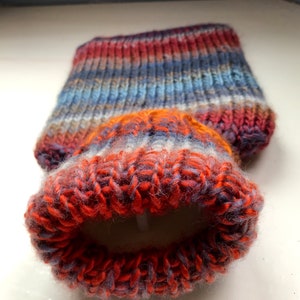 Mini hot water bottle and hand knitted lightly felted cozy, wool rich cover, mini 500ml, blended colours, reds, blues, glowing orange image 4