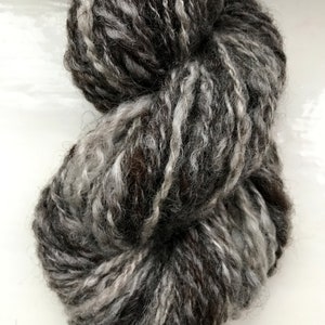 Hand spun yarn, hand carded from scoured raw fleece, self plied, natural greys, chunky