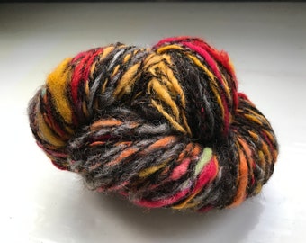 Handspun, hand dyed art yarn, fat chunky skein, fire colours, suitable for knitting or for weaving projects.