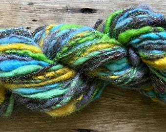 Handspun art yarn, core-spun, browns, blues, apple green, yellow, chunky