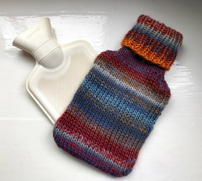 Mini hot water bottle and hand knitted lightly felted cozy, wool rich cover, mini 500ml, blended colours, reds, blues, glowing orange image 7