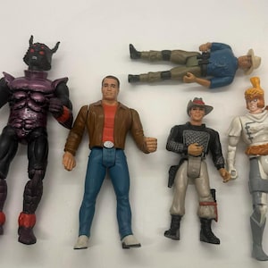 May include: A collection of six action figures. The figures include a muscular purple and black monster, a man in a brown jacket and blue jeans, a cowboy, a man in a blue shirt and khaki pants, and a knight in white and gray armor.