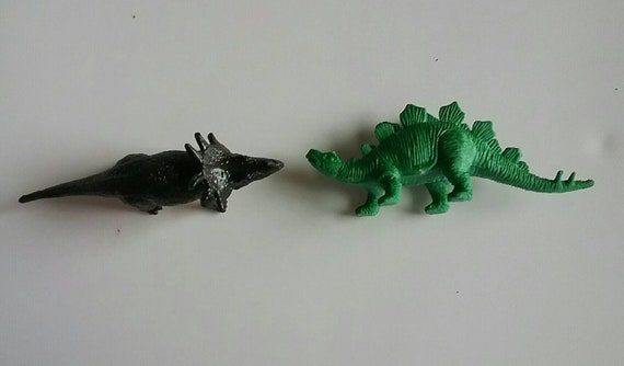 tiny plastic dinosaurs