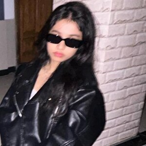 Trendy black faux leather biker jacket styled with oversized streetwear fashion and edgy Y2K aesthetics. Featuring a classic asymmetric front zipper, wide lapel collar, and relaxed moto silhouette, this casual leatherjacket creates the perfect blend of vintage biker style and modern urban fashion. Inspired by retro moto jackets and minimalist street style, this women leather jacket pairs effortlessly with denim, boots, and layered outfits for fall winter fashion. A must-have statement outerwear