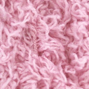 May include: A skein of soft, pink, fluffy yarn.