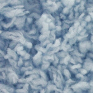 May include: A close-up of a light blue fluffy yarn. The yarn is soft and textured, ideal for knitting or crocheting.