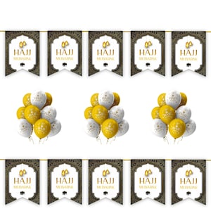 May include: A festive banner with the words "HAJJ MUBARAK" in gold lettering, accompanied by gold and white balloons. The banner has a dark background with an ornate design, and the balloons are clustered in groups.