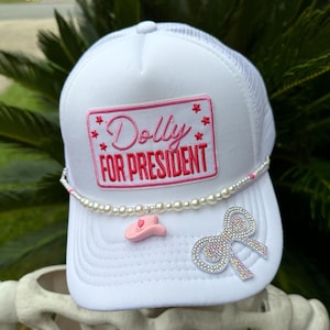 Dolly for President Patch White Trucker Hat | Queen of Country | Rhinestone Bow | Optional Pearl Hat Chain with Pink Cowboy Hat Charm