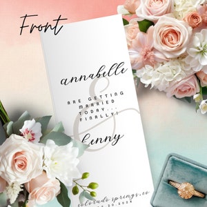 May include: A white wedding invitation featuring the names "Annabelle" and "Lenny" in stylish script. The text "ARE GETTING MARRIED TODAY... FINALLY!" is also displayed. The invitation is set against a backdrop of flowers and a ring box.
