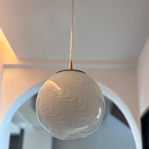 Hand-Blown Glass Globe Pendant Light: Milky White with Blue Waves, Brass Hardware