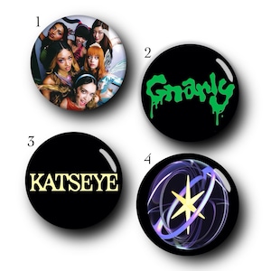 May include: Four circular pin-back buttons. Button 1 features a group of six individuals. Button 2 has a black background with the green text Gnarly. Button 3 has a black background with the yellow text KATSEYE. Button 4 shows a yellow star icon.