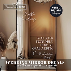 May include: A large arched mirror with the text "Hello Darling" and "You look incredible, now go grab a drink." The image also includes the text "Wedding Mirror Decals" and "Vinyl Decals 6 Sizes."