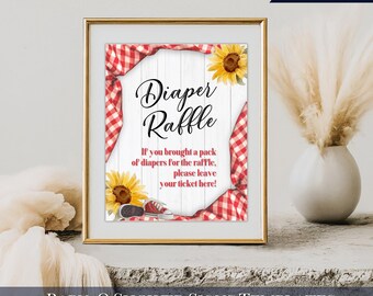May include: A printable sign for a baby shower with a red and white gingham pattern, sunflowers, and the text "Diaper Raffle". The sign says "If you brought a pack of diapers for the raffle, please leave your ticket here!"