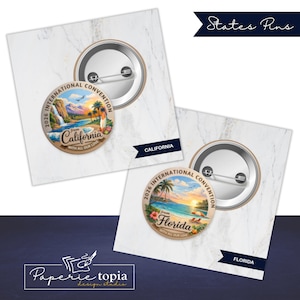 May include: Two round pin-back buttons featuring colorful illustrations of California and Florida. Each pin displays the text 2026 INTERNATIONAL CONVENTION, the state name, and WITH ALL OUR LOVE. The pins show metal backs with safety pin closures.