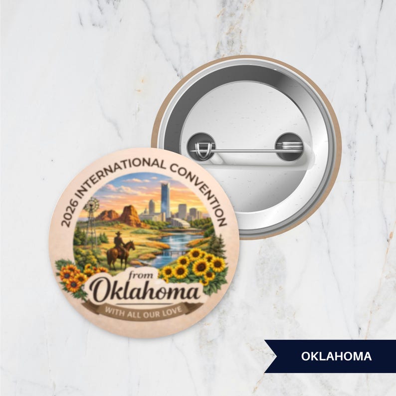 May include: A round pinback button featuring a colorful illustration of a cowboy on horseback, sunflowers, and a city skyline. The text reads 2026 INTERNATIONAL CONVENTION from Oklahoma WITH ALL OUR LOVE. The back shows a metal pin mechanism.