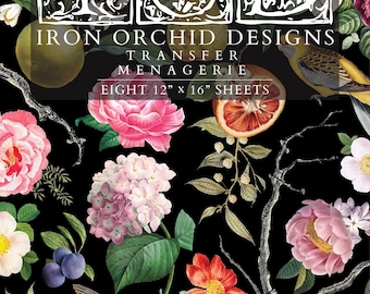 May include: A decorative transfer set featuring a black background with botanical illustrations of pink and white flowers, citrus fruits, and birds. The text reads IOD IRON ORCHID DESIGNS TRANSFER MENAGERIE EIGHT 12" x 16" SHEETS in white lettering.