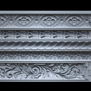 May include: A silicone mold with five different decorative trim designs. The mold is gray and features measurements in millimeters and grams. The text "IOD TRIMMINGS 2" is printed on the bottom right corner of the mold.