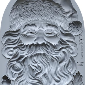 May include: A gray silicone mold featuring a detailed relief of Santa Claus's face, beard, and hat. The mold includes text that reads "SAINT NICK IOD" and measurements of 153ml and 230g. Additional measurements are also included.