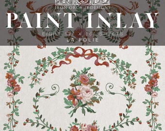 May include: A paint inlay set with floral and botanical patterns. The image shows the text "PAINT INLAY" and "EIGHT 30.5 x 40.6 cm SHEETS." The design includes roses, greenery, and the words "LA FOLIE" and "1789."