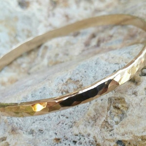 Gold Bangle Bracelet thick and wide with hammered shiny texture. Available in Gold Filled or 14kt Gold. Engraving Included