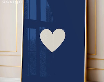 May include: A rectangular wall art print featuring a solid navy blue background with a centered, off-white heart shape. The artwork is encased in a thin gold-colored frame. The text maru design is visible in the upper left corner of the image.
