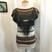 see more listings in the Blouses / Tops / Shirts section