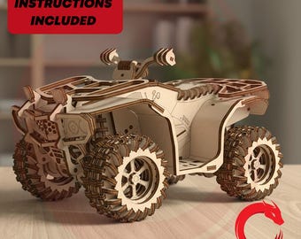 May include: A laser-cut wooden model of an all-terrain vehicle featuring intricate layered panels, textured wheels, and handlebars. The model includes the text PDF-ASSEMBLY INSTRUCTIONS INCLUDED and DRAGON LASER CUT with a red dragon logo.