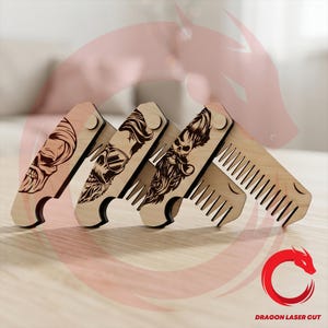 May include: Three light-colored wooden folding combs featuring laser-engraved designs of bearded figures. Each comb has a pivoting handle and a row of teeth. The engravings depict stylized faces with detailed hair and beards. The text DRAGON LASER CUT is visible in the bottom right corner.