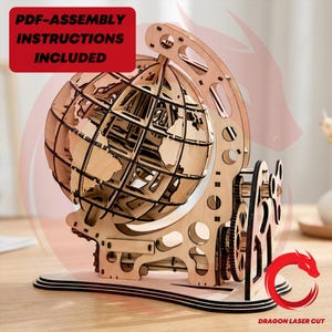 May include: A wooden globe model with a detailed world map design. The model features a gear system and is made of light-coloured wood. Text on the image reads "PDF-ASSEMBLY INSTRUCTIONS INCLUDED".