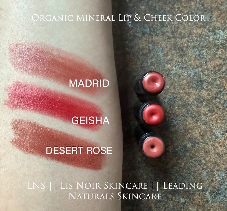 Showing ‘LNS’ ‘Lis Noir Skincare’ ‘Leading Naturals Skincare’ Red Lipstick Shades swiped on skin from top to bottom, listed as ‘Madrid’, ‘Geisha’, ‘Desert Rose’.
