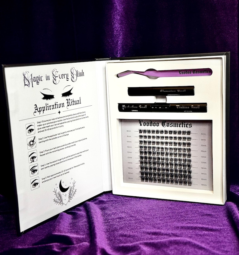Open Grimoire of Lashes lash book showing lash clusters, purple tweezer, bond, and sealant for goth lash applications.