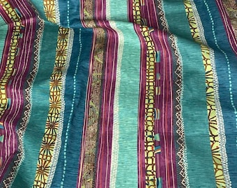 May include: A fabric featuring vertical stripes in shades of teal, purple, and lime green. The pattern includes alternating bands of solid colors, intricate geometric shapes, dotted lines, and stylized floral motifs with a textured appearance.
