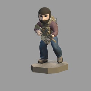 May include: A figurine of a person in tactical gear, holding a rifle. The figure wears a black balaclava, a camouflage vest, and a backpack. The person is wearing a maroon shirt and blue jeans. The figurine stands on a tan hexagonal base.