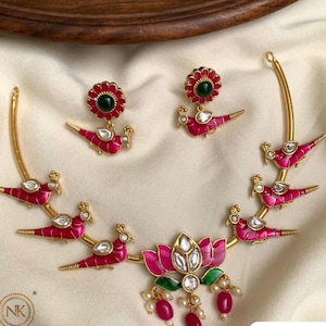 Rama Birds and Lotus Motif Haili in Gold Set with Pearl Hangings studded with Diamonds and Rubies