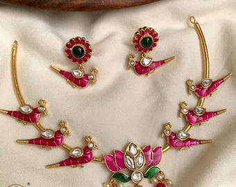 Rama Birds and Lotus Motif Haili in Gold Set with Pearl Hangings studded with Diamonds and Rubies