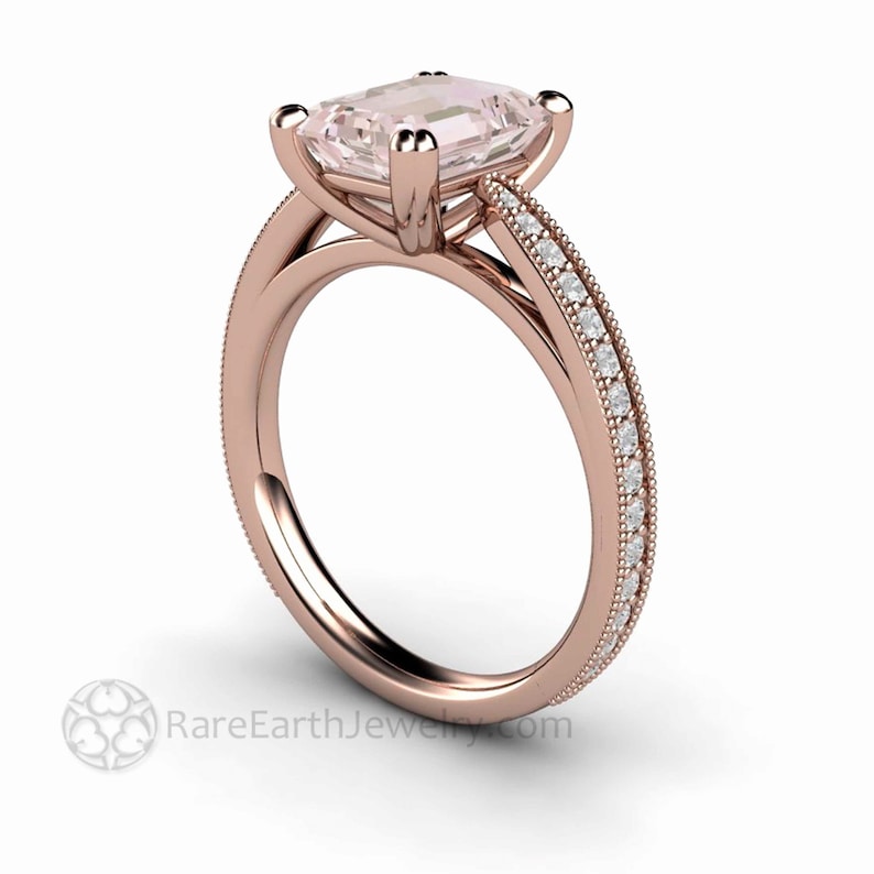 May include: A rose gold engagement ring with a square-shaped pink gemstone and a band of smaller diamonds.