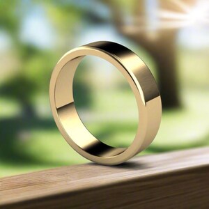 Puede incluir: Una sencilla alianza de oro con acabado cepillado.