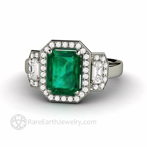 Emerald cut green emerald ring 3 stone jlo engagement ring style green gemstone ring like jennifer lopez engagement ring