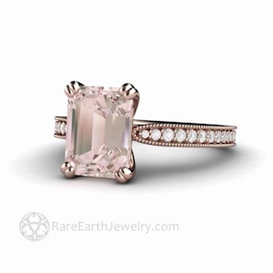 May include: A rose gold engagement ring with a large, pale pink, emerald-cut gemstone and a delicate band of smaller diamonds.