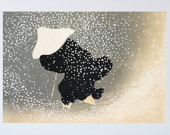 May include: A framed print of a black and white illustration of a person in a white hat walking in a snowy landscape. The print is framed in a gold frame and is hanging on a dark blue wall.