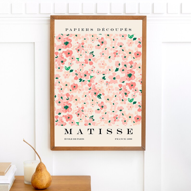 May include: A framed print of a pink floral design with the text "PAPIERS DECOUPES MATISSE ECOLE DE PARIS FRANCE 1890".