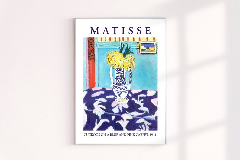 May include: A painting by Henri Matisse titled "Cuckoos on a Blue and Pink Carpet, 1911". The painting depicts a vase of yellow flowers on a table with a blue and pink patterned tablecloth. The background is a blue wall with a red curtain and a small painting on the wall.