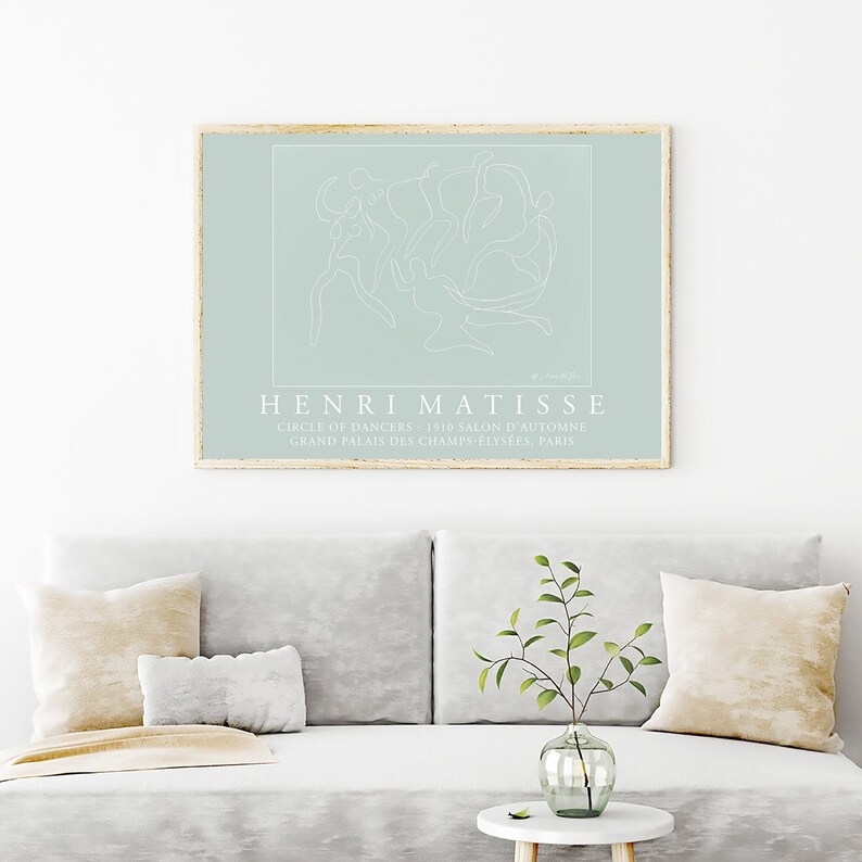 May include: A minimalist line art print of Henri Matisse's "Circle of Dancers" painting on a light blue background. The print features the text "HENRI MATISSE", "CIRCLE OF DANCERS - 1910 SALON D'AUTOMNE", and "GRANDE PALAIS DES CHAMPS-ELYSEES, PARIS".